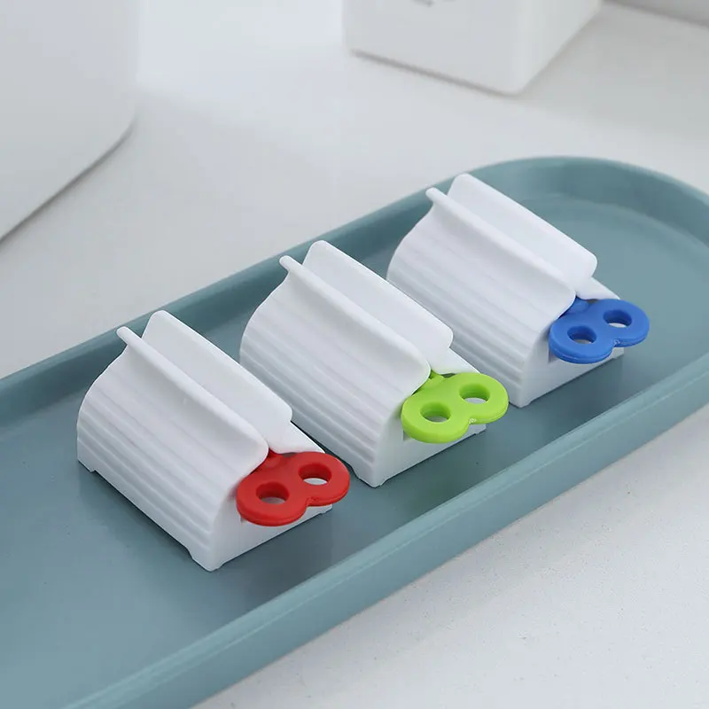 

1PC Rolling Tube Toothpaste Squeezer Dispenser Toothpaste Facial Cleanser Press Rolling Seat Holder Bathroom Accessories