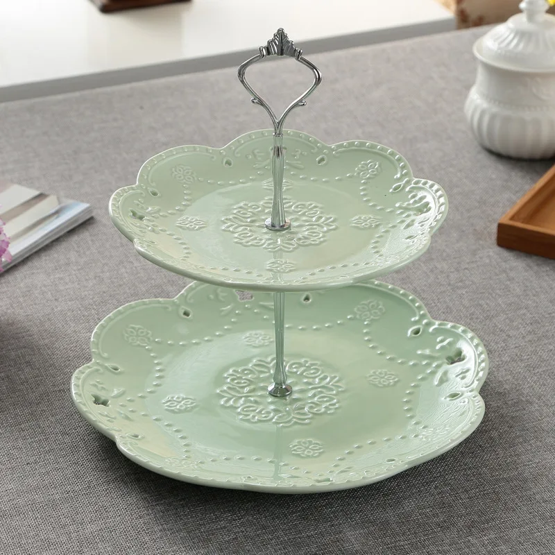 

Direct sales new color glaze butterfly ceramic embossed hollow plate fruit cake snack jewelry storage decoration display plate