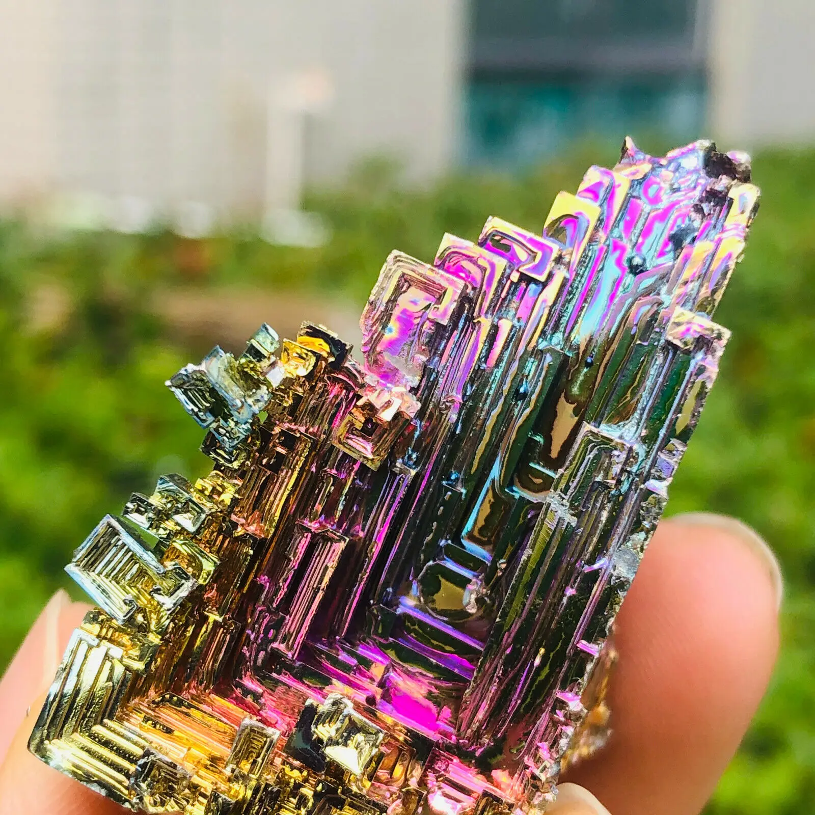 

Sample of crystal quartz mineral point of titanium alloy rainbow bismuth ore