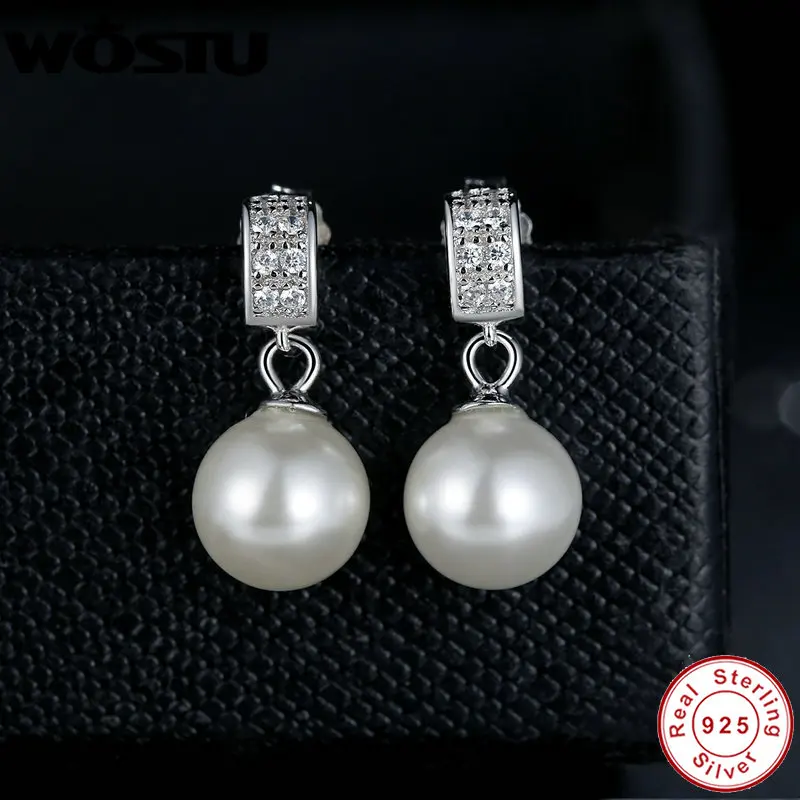 Женские серьги-подвески из серебра 100% пробы с прозрачным фианитом и жемчугом |