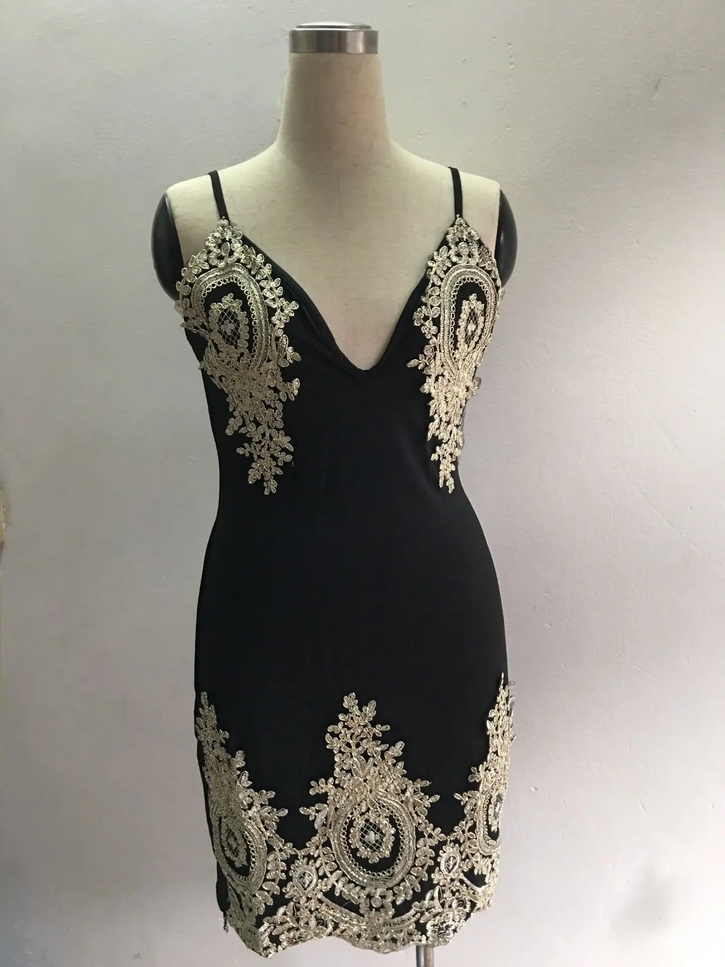 

2021 European and American nightclub bag hip short skirt suspenders sexy V-neck tight stretch dress