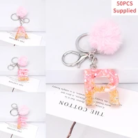 50pcs pink hair pompom key chains faux fur ball 26 letter crystal epoxy cute keyring handbag charms pendants for women gift