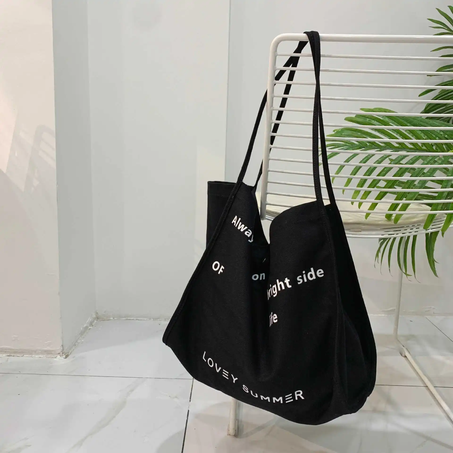 

Love. S Korean version ins letter printing open thin shoulder strap large capacity canvas bag women's simple leisure shoulder