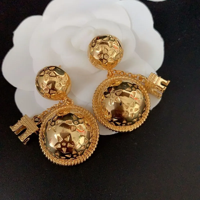 

Vintage stereo planet Arc de Triomphe brass earrings retro temperament earrings
