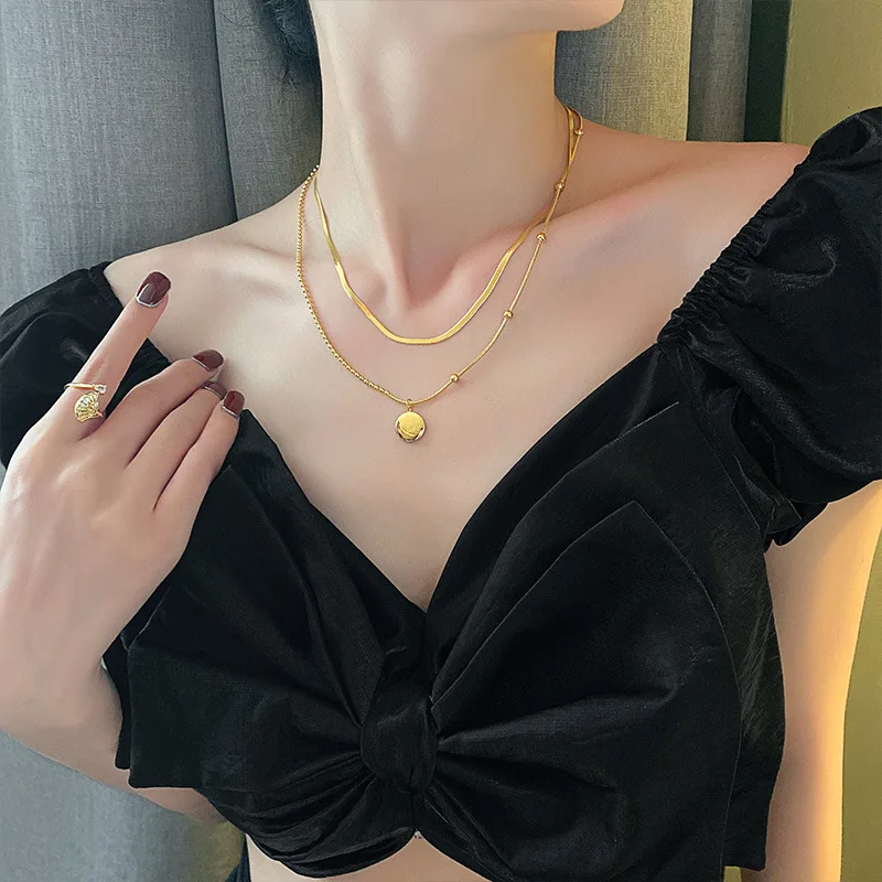 

Fashionable titanium steel round brand letter snake bone chain fold wear double sweater chain women's South Korean suit with cla