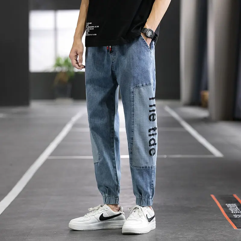 Autumn Men's Denim Harem Pants Letter Print Ankle Banded Elastic Waist Blue Baggy Jeans Stitching Cropped Pants Hip Hop Jeans