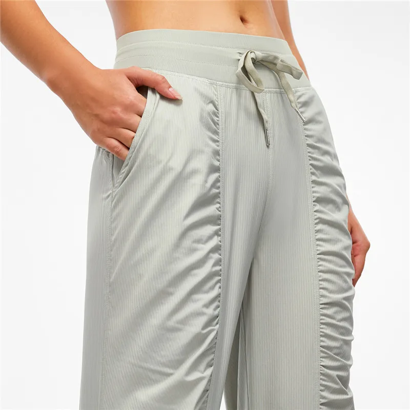 Women Sport Pants Fitness Yoga Legging Natural Folds Quick-drying And Breathable Drawstring Feet Loose Trousers With Pocket