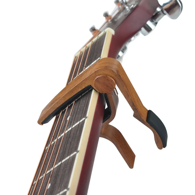 

Hot New Wood Silicon Grain Guitar Capo with Perfect Cushion for Guitar Ukulele Tuning Musical Instrument Accessories Guitar Clip