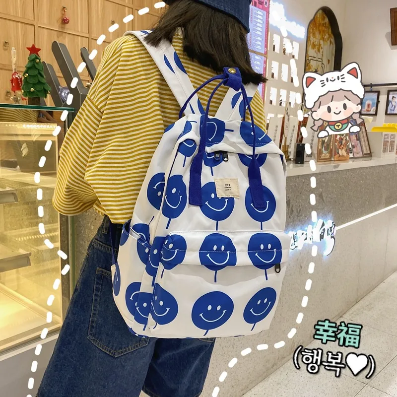 

College students satchel new fashion smiling face printing backpack backpack female Korean travel junior high school backpack