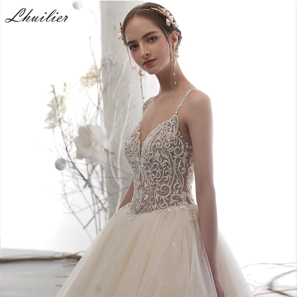 Kopen Lhuilier A-lijn V-hals Backless Tulle Wedding Dresses 2020 Luxe Mouwloze Crystal Kralen Kapel Trein Champagne Bridal Jurk