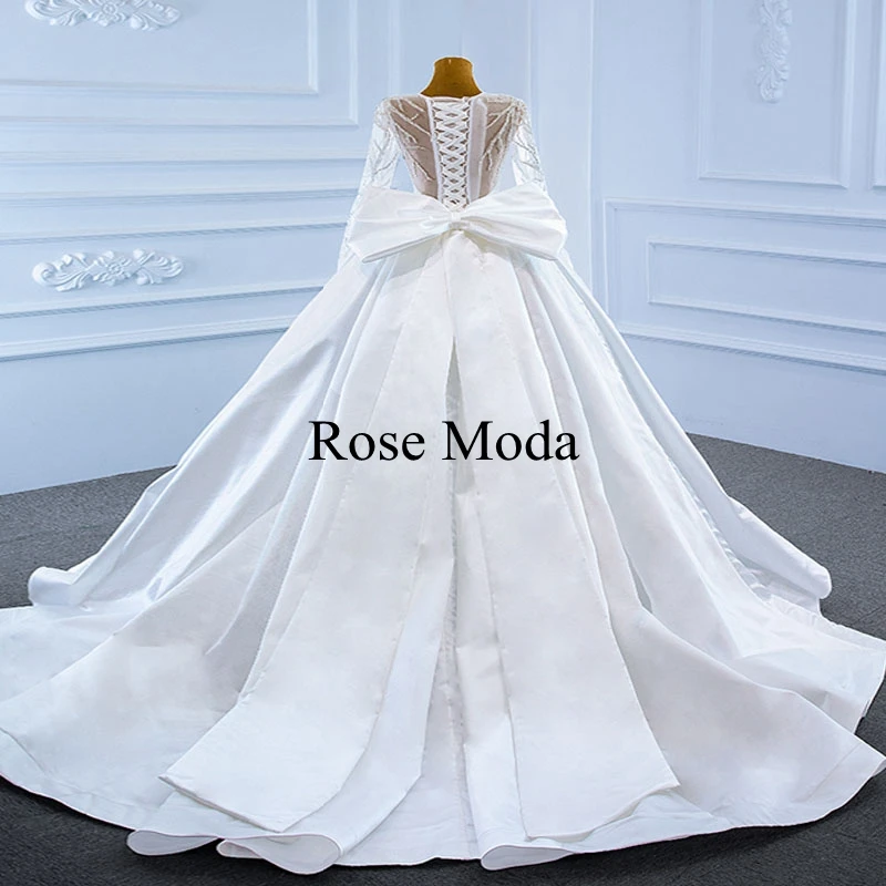 Rose Moda Luxury Beaded Long Sleeves Satin Wedding Dress with Removable Big Bow Puffy Ball Gown