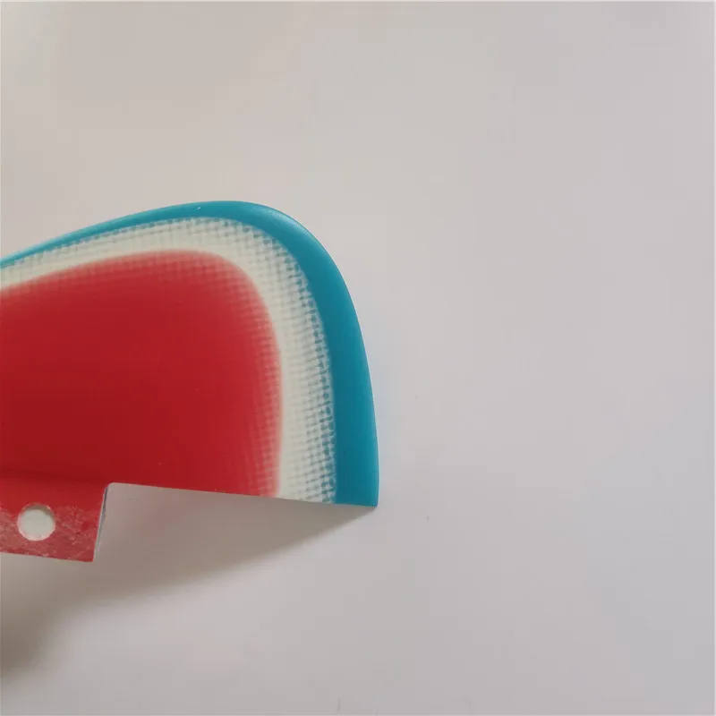 

three color coming surfboard fins in fiberglass