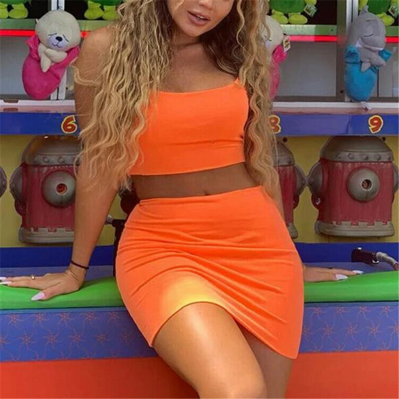 Женский праздничный костюм двойка неоново зеленого и оранжевого цвета