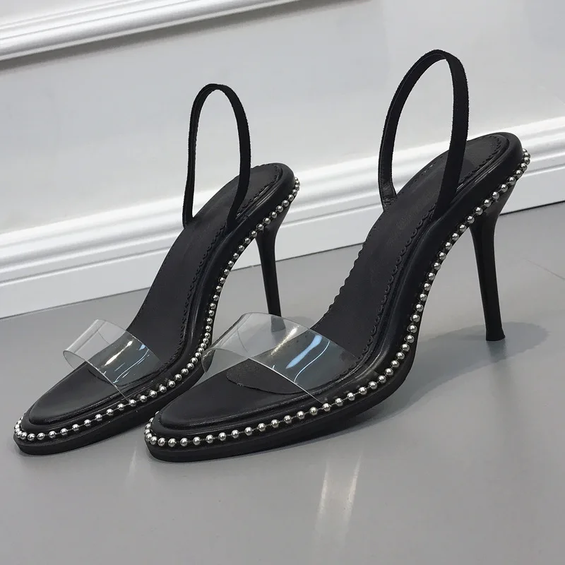 

Shoes women's summer 2021 new Korean rivet thin heel high heels sexy transparent one word with black sandals