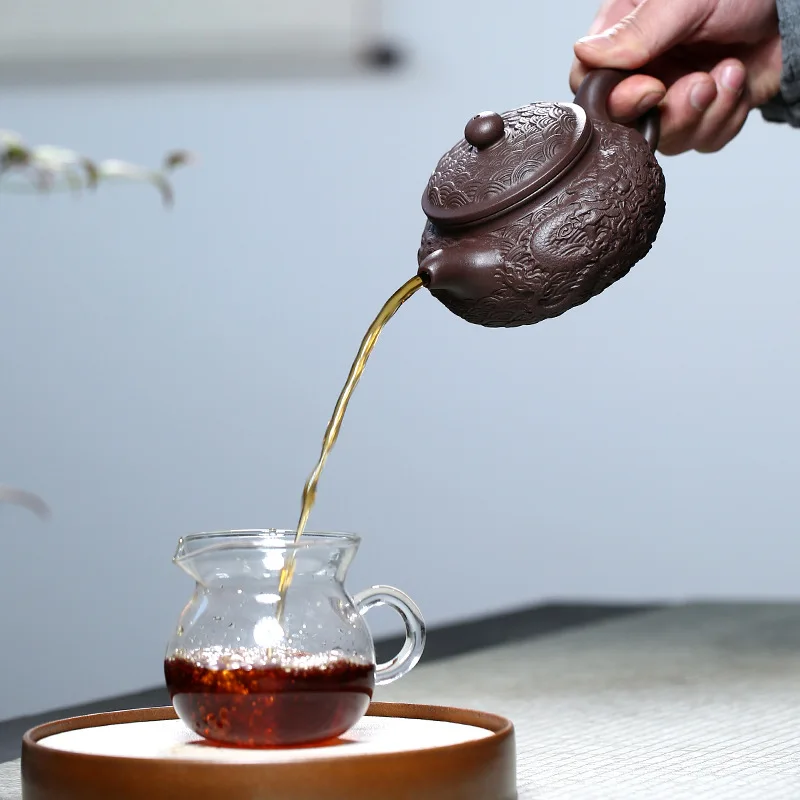 

Purple clay teapot handmade original ore old purple mud dragon ball four seas relief teapot Kungfu tea set