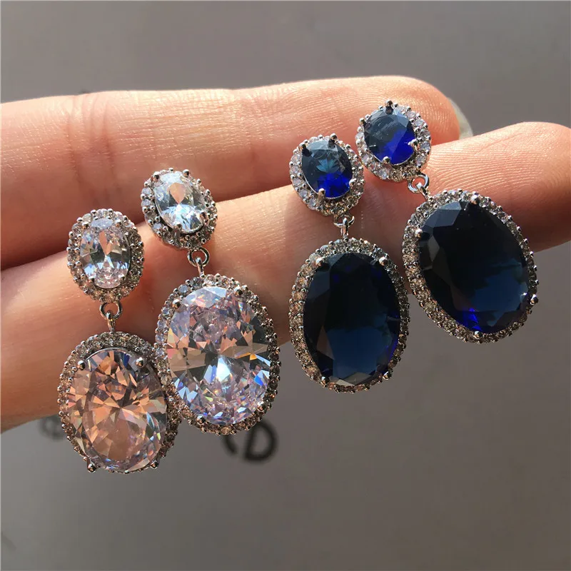 Роскошные женские серьги гвоздики серебряного цвета с крупными фиолетовыми