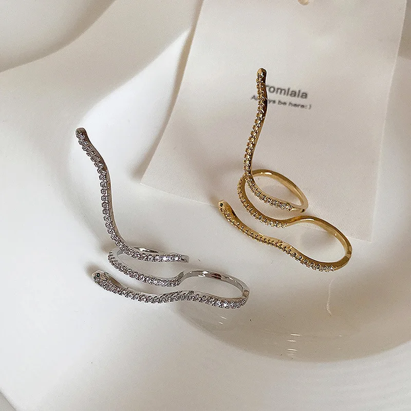 

Minar Luxury Unique Sparkly Rhinestone Twist Snake Rings for Women Gold Color Alloy Long Animal Charm Ring Statement Jewelry