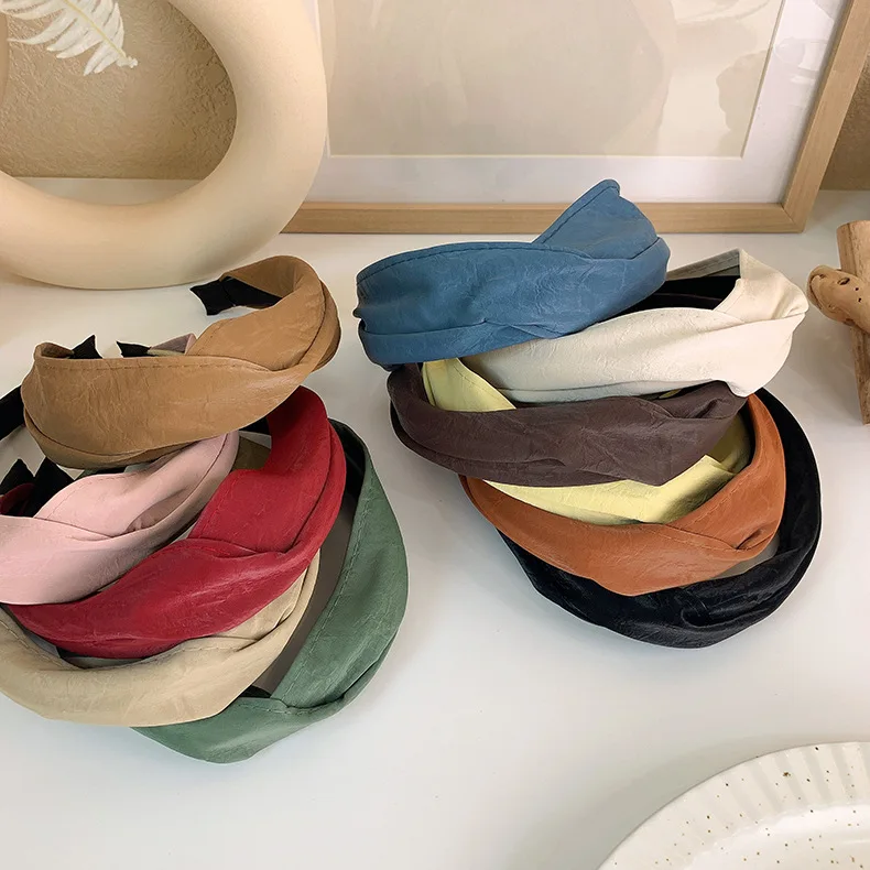 

Retro solid color Pu leather wide cross headband female wild outer starting hoop simple wash hair band pressure hair headdress