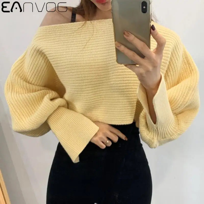 

Женский трикотажный пуловер с открытыми плечами и рукавами-фонариками