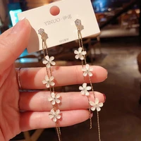 xiyanike fairy tassel gold chain earrings long vertical white four flowers pendant earrings elegant fashion jewelry for women