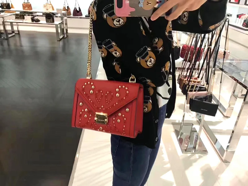 

Vintage and versatile embroidered hollow rivet flip envelope women's bag slanting chain bag leather women's bag