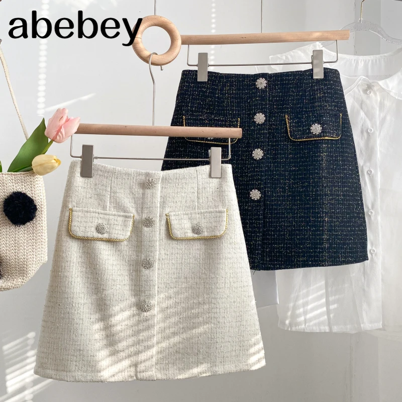 

Korean solid color woolen Skirt diamonds single breasted double pockets high waist short A-line Skirt 2021 New Spring Autumn