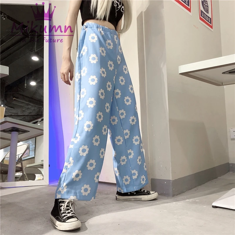 Женские свободные брюки с цветочным принтом оранжевые черные синие прямые