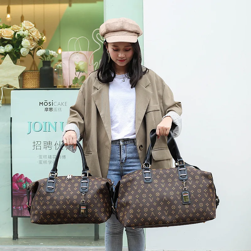 

A new leisure travel bag portable bag business travel bag classic high-capacity PU leather bag travel bag