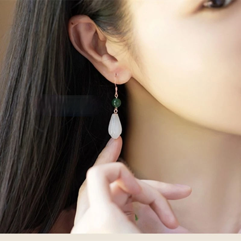 

The designer's unique creative silver inlaid natural Hetian jade long earrings wild temperament high-end women's jewelry