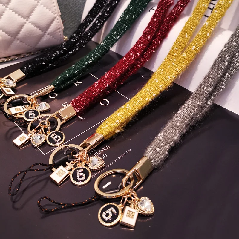

Mobile phone lanyard female hand-woven woolen yarn small fragrance pendant mobile phone case universal removable anti-lost rope