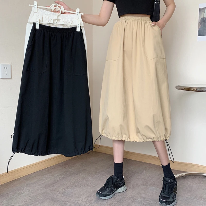 Женская юбка с завышенной талией трапециевидная средней длины завязками в стиле