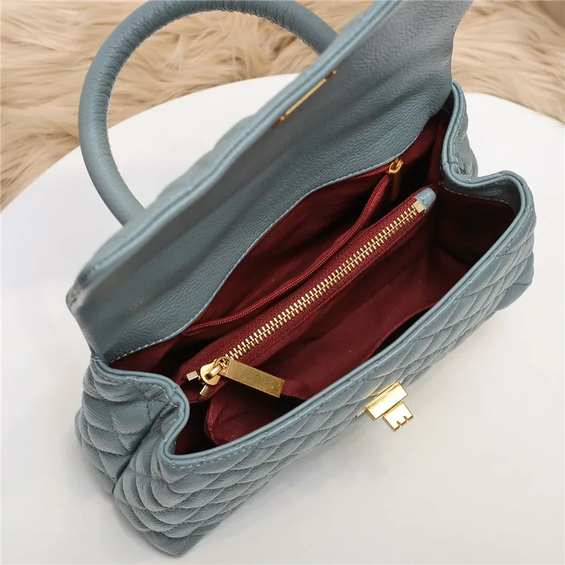 

Small Xiangfeng cowhide litchi grain women's bag fashionable and versatile, large capacity diagonal chain portable shoulder bag