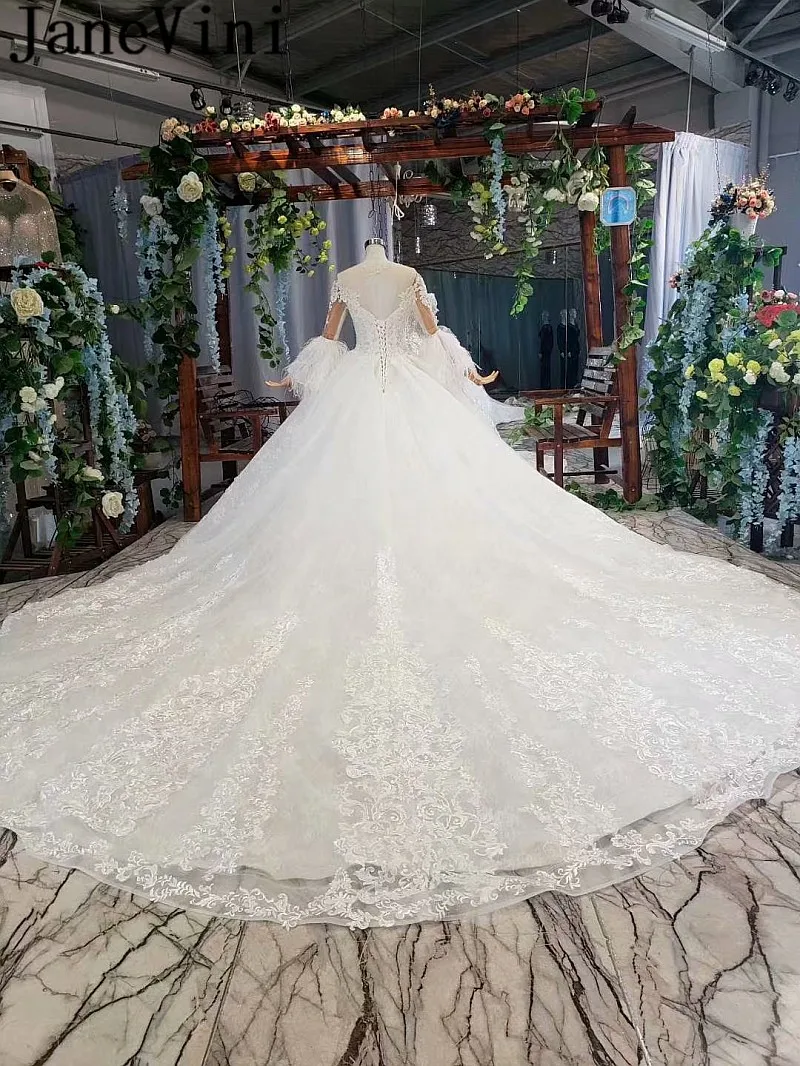 JaneVini Dubai Beaded Wedding Dress Feathers Long Sleeves Lace Pearls Ball Gown Bridal Dresses Luxury African Wedding Gowns 2020