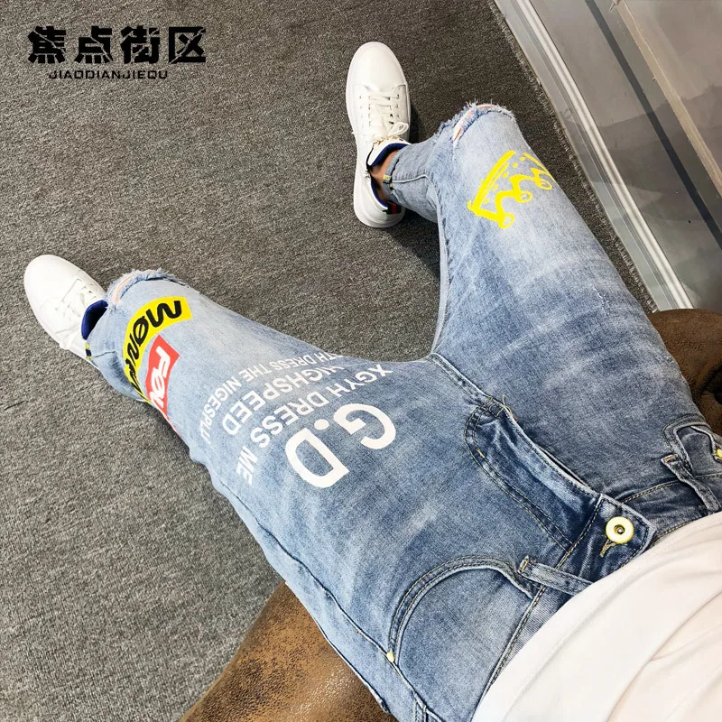 

Fashion 2021 Autumn jeans male Korean social spirit guy Slim feet jeans stretch ripped hole Letter printed ankle length pants
