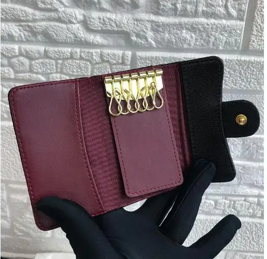 

Portallaves de cuero genuino de diseo de alta calidad para mujer, cartera para ama de casa, organizador de llaves