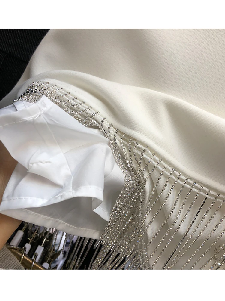 

Firstsong Women's Heavy Craft Tassel Diamond Hem High Waist Skirt 2020New Summer Sexy Irregular Hip Bag Black Women's Mini Skirt