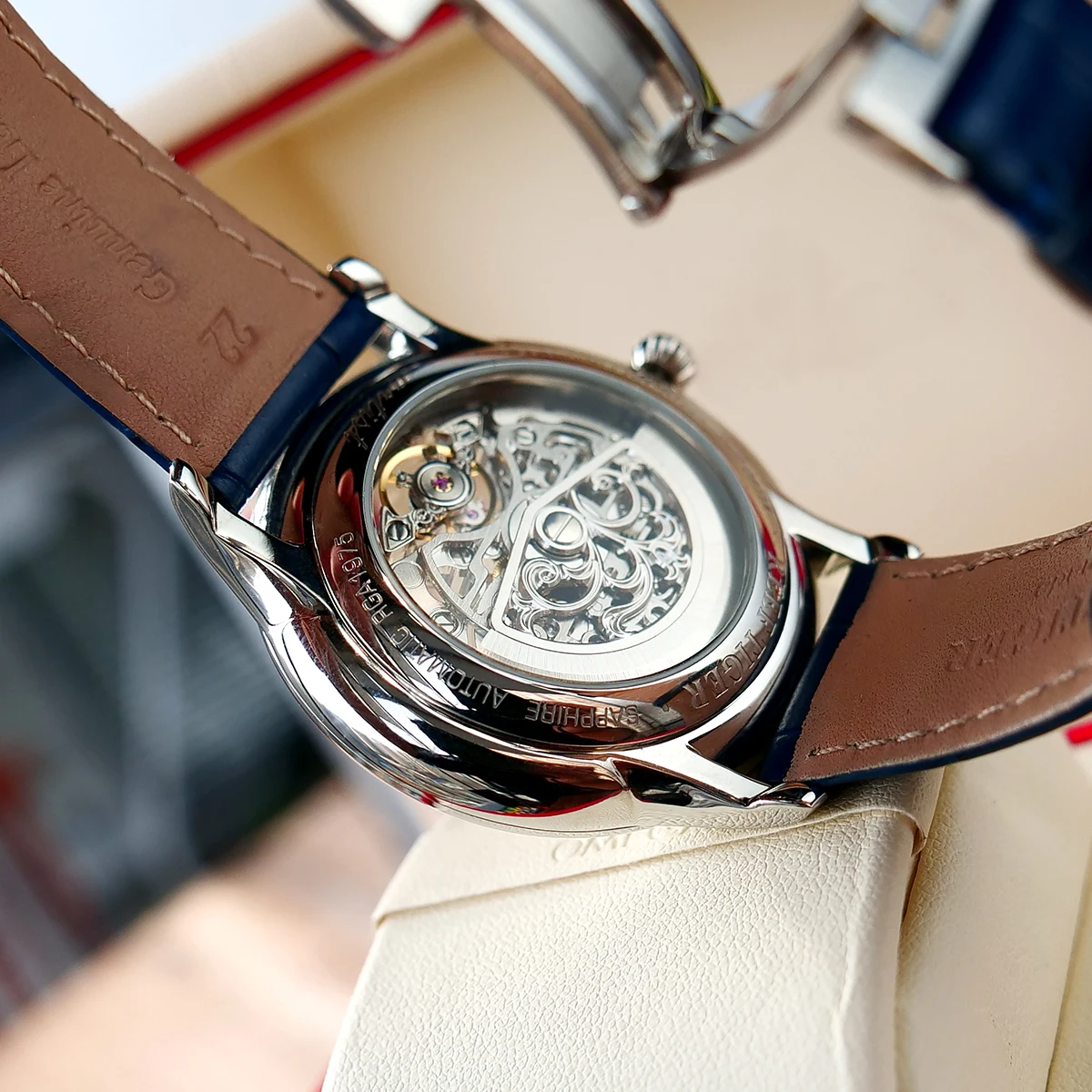 

Reef Tiger/RT Mens Designer Automatic Watch Steel Case Yellow Gold Skeleton Dial Blue Leather Strap Watch RGA1975