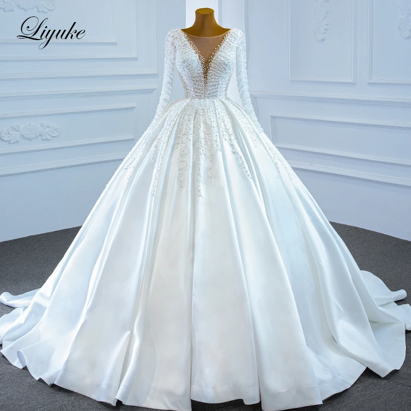 

Liyuke Exquisite Luxury Pearls Long Sleeve Ball Gown Wedding Dress With Deep V Neck Beads Satin Skirt Bridal Gown