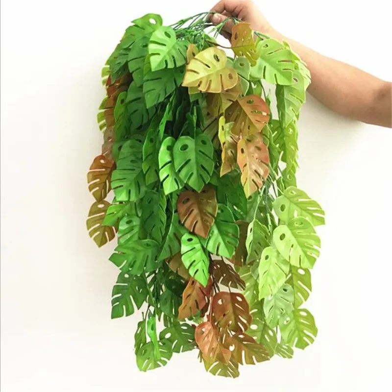 

Plastic Palm Monstera Deliciosa Leaf Hanging Vine Artificial Green Plant Maple Tree Stem Branch for Greenery Wall Decoration