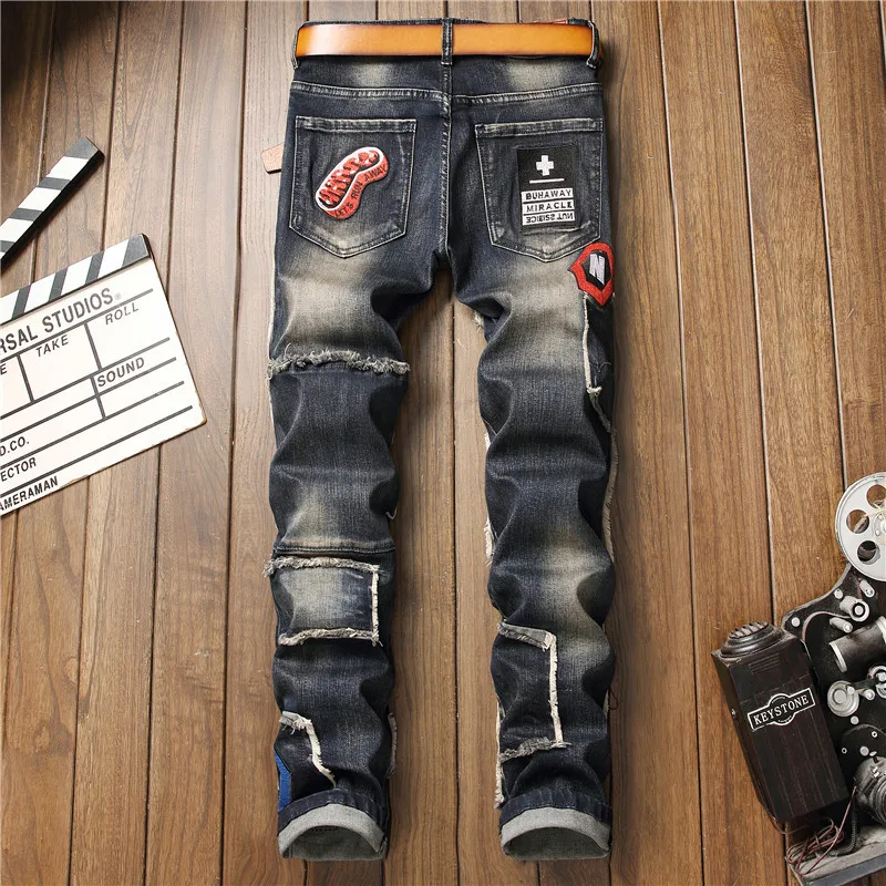 

Mens Badge Patchwork Ripped Embroidered Stretch Jeans Male Trendy Holes Patches Design Slim Straight Men Denim Pant Dropshipping
