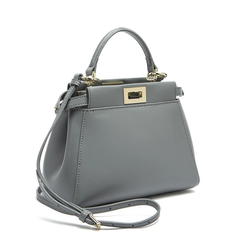 

2019 new spring and summer Korean cowhide women's bag kitten bag hand-held Crossbody lock cowhide women's single shoulder bag