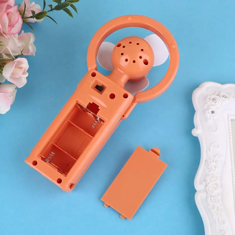 

New Mini Travel Desk Cool Air Fan Hand Held Cooling Fan Powered By 2x AA Battery