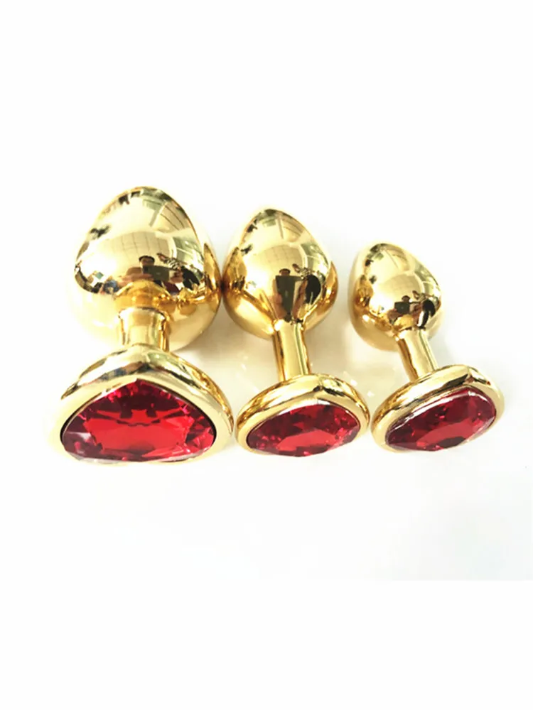 Анальная пробка золотого цвета 3 размера вы можете выбрать интимные игрушки для