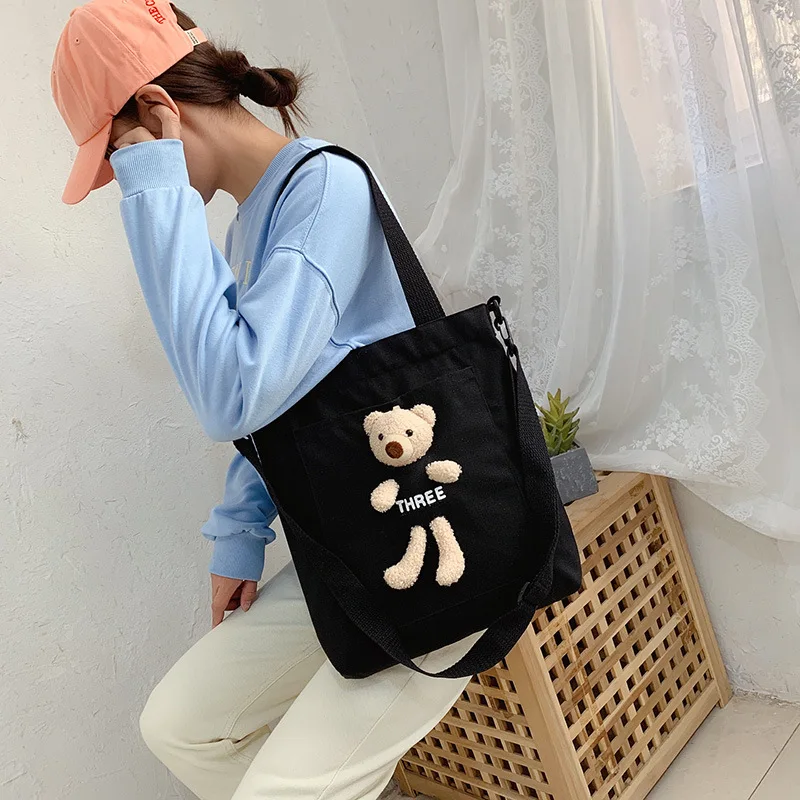 

2022 fashion online celebrity canvas bag new portable diagonal single backpack girl cute bear wild trend bag.