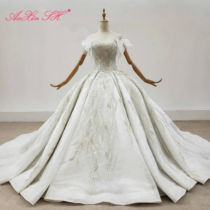 

AnXin SH luxury princess beading crystal illusion ruffles handmade boat neck white flower lace wedding dress 100% real photos