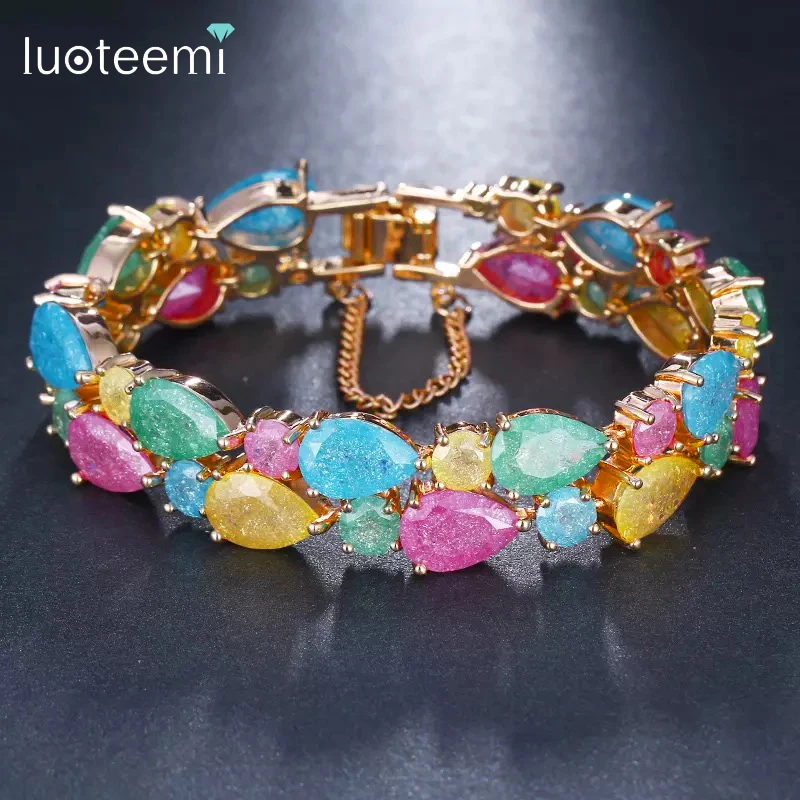 

LUOTEEMI Rainbow Waterdrop Ice Cutting Cubic Zircon Champagne Color Fashion Mona Lisa Bracelet for Women Large Stunning Bangle