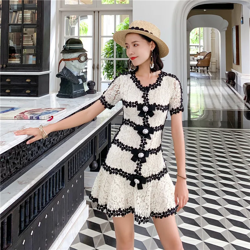 

Seaside holiday dress lace stitching small fragrance Celebrity Slim bow Ruffle Skirt