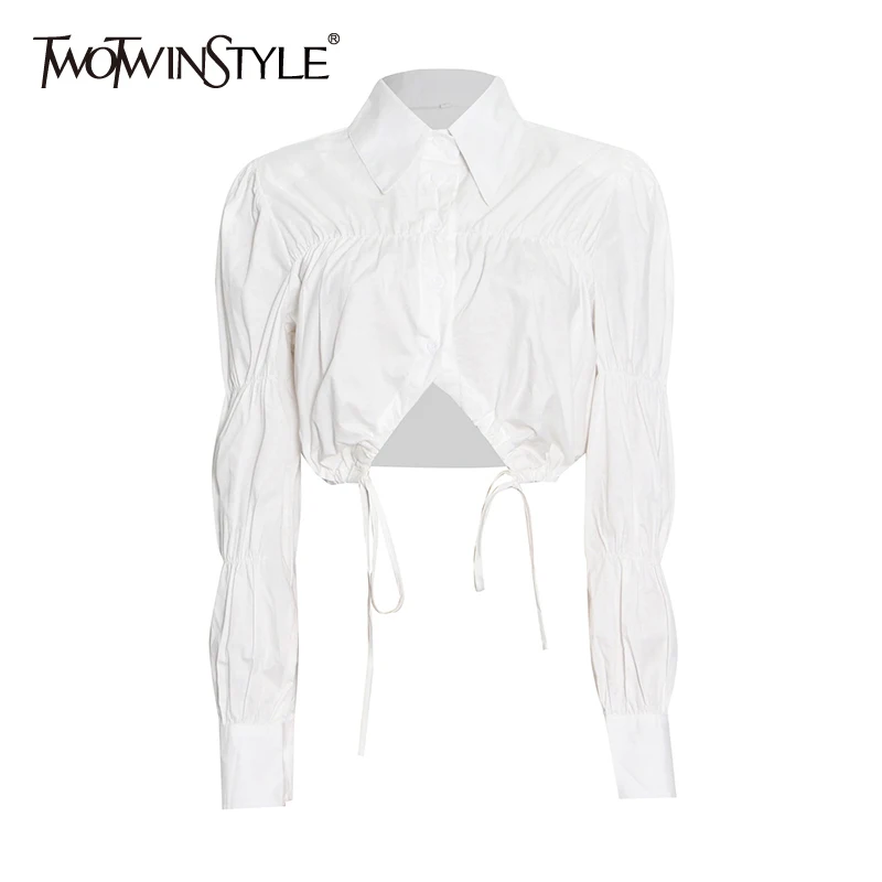 

TWOTWINSTYLE White Casual Fold Pleated Shirt For Women Lapel Collar Puff Sleeve Hollow Out Slim Shirts Female 2021 Fashion Style