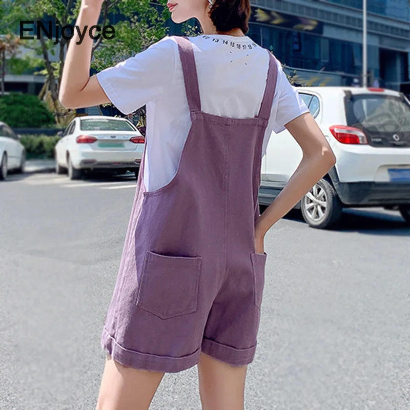 Женский джинсовый комбинезон повседневный зеленый на бретельках с большими