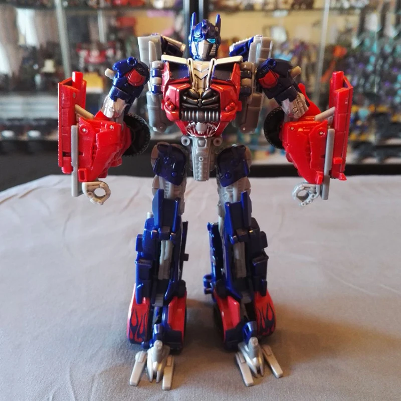 

Tomy Transformation Toys Deformation Robot PVC Metal Part OptimusS712 Autobots Robots Boy Birthday Gifts Transformed Toy